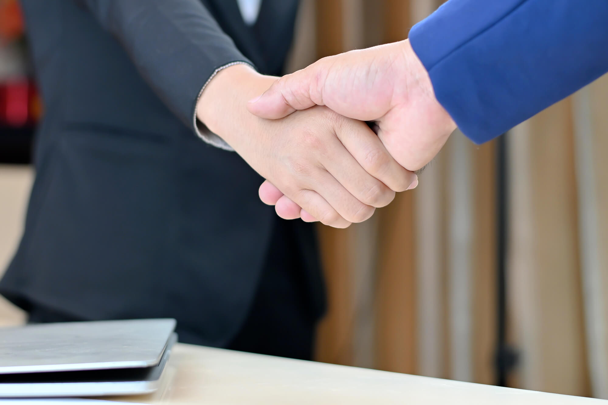 Business people shake hands for a successful business deal