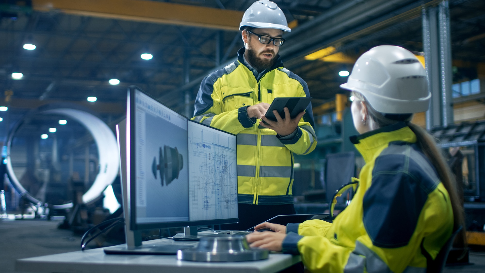 Inside the Heavy Industry Factory Female Industrial Engineer Works on Personal Computer
