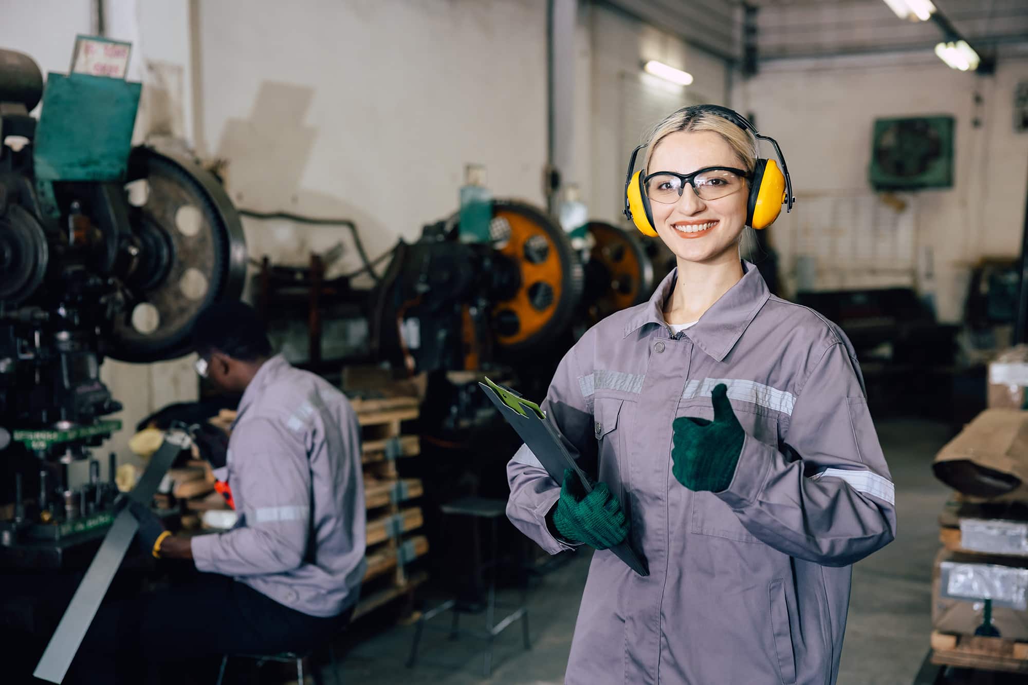 portrait professional worker working in heavy metal industry factory happy smiling enjoy working
