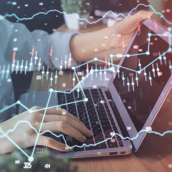 Double exposure of woman hands typing on computer and forex chart hologram Double exposure of woman hands typing on computer and forex chart hologram