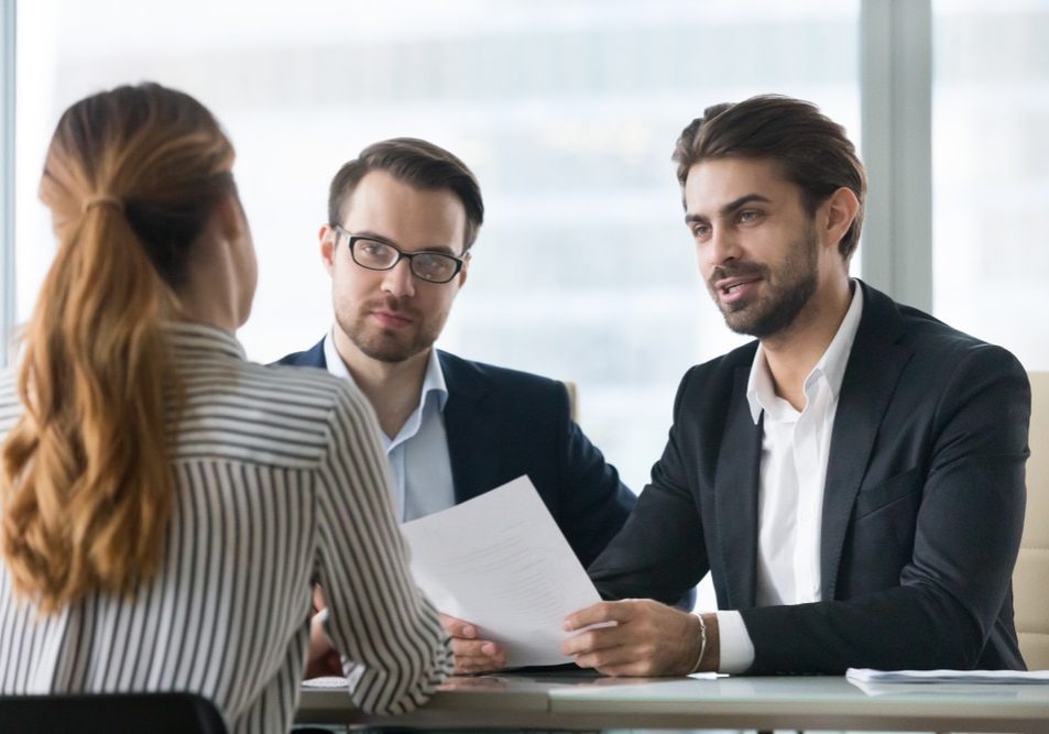 Two male HR managers at Interview with female applicant man