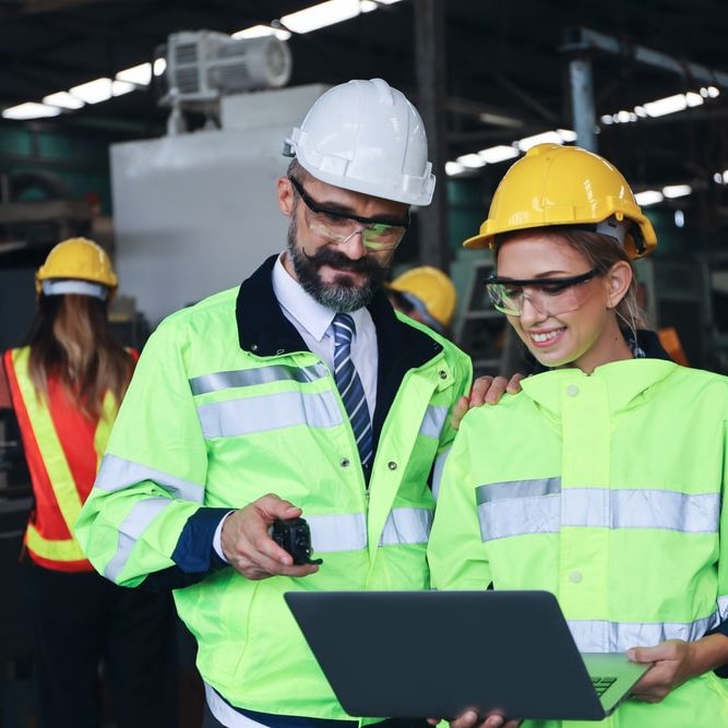 Manager or supervisor talking or discussing with engineering