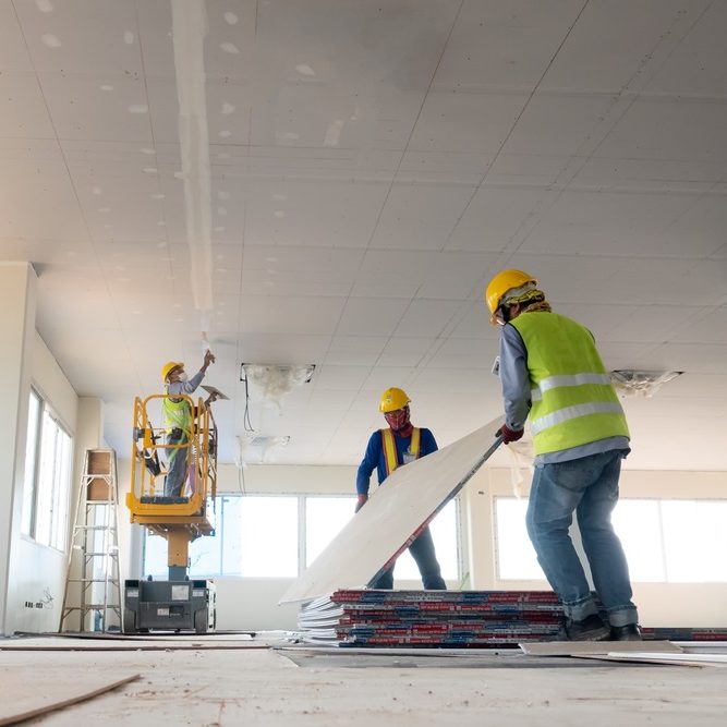 Construction worker installation ceiling work Construction worker installation ceiling work
