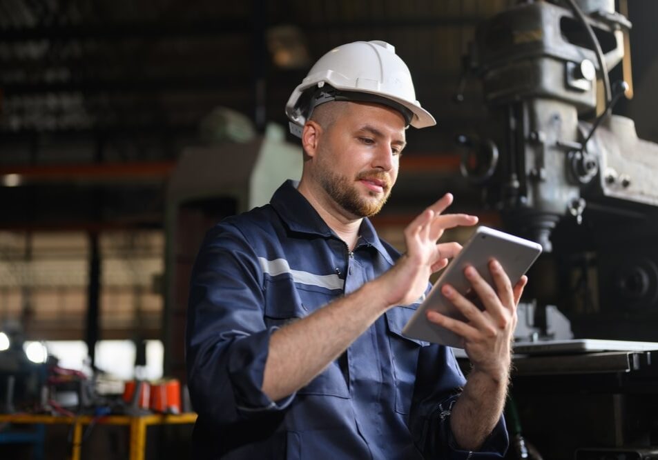 Professional,Male,Technician,Engineer,Using,Tablet,Checking,And,Controlling,Machine Professional male technician engineer using tablet checking and controlling machine at manufacturing factory
