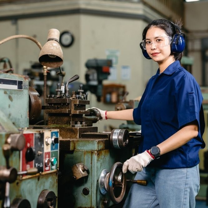 Portrait happy engineer worker with safety eyes protection