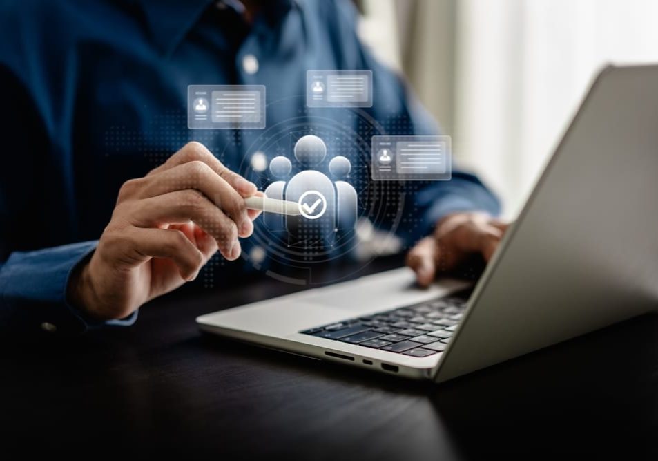 Human Resources Manager use stylus pen point to human icons for select hiring Human Resources Manager use stylus pen point to human icons for select hiring