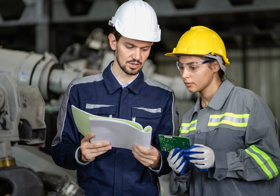 Handsome,Manager,Train,Female,Technician,To,Work,In,Automated,Production Handsome manager train female technician to work in automated production factory.