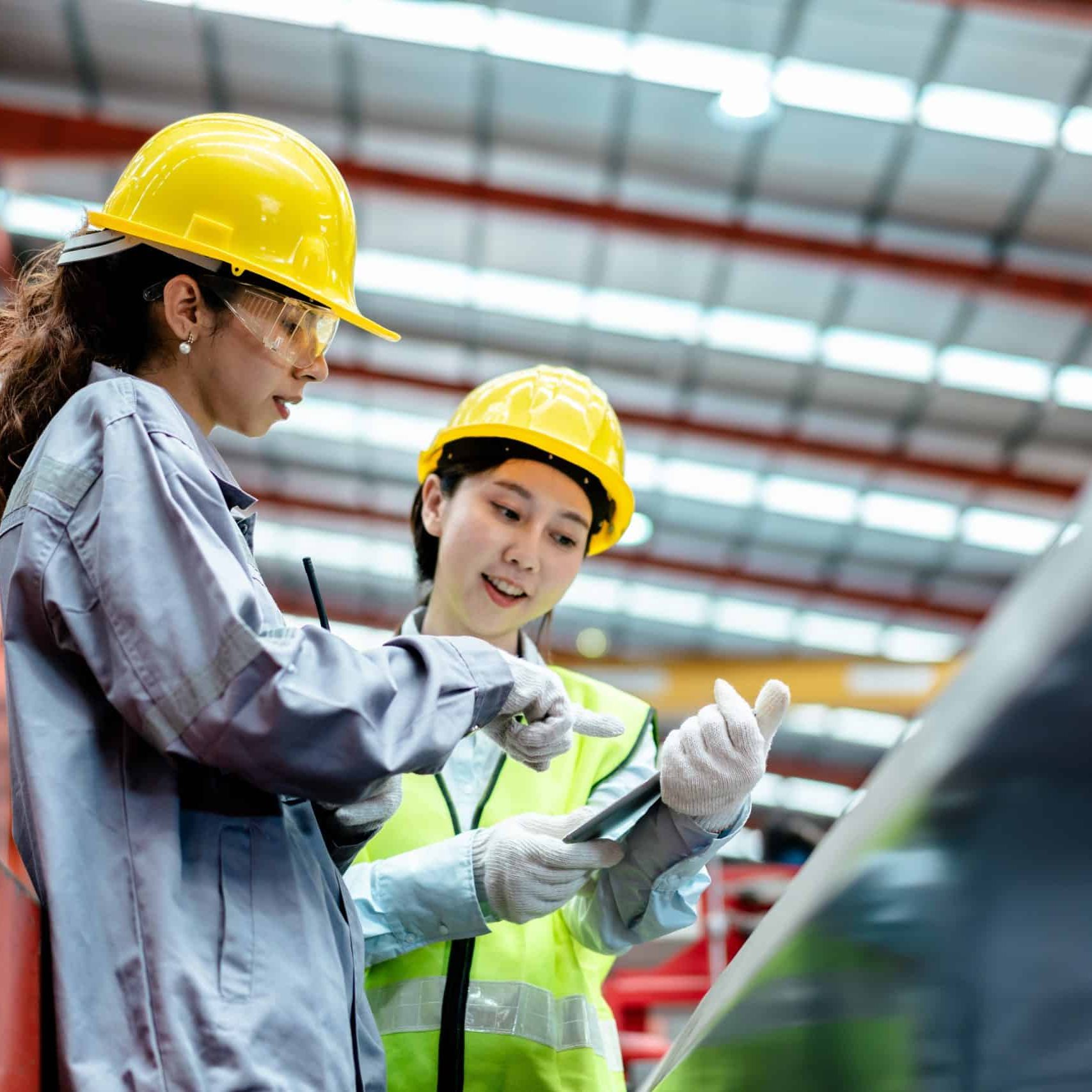 Female worker in safety uniform together work inspecting operation manufacturing Metal Roofing Sheet Machine