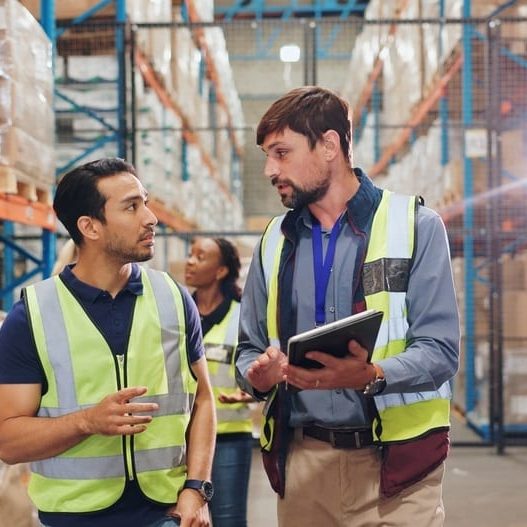 Quality assurance, tech and team discussion in factory for export industry and ecommerce store